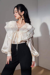 Silk wide-leg tailored pants with high waist and clean front seam detailing